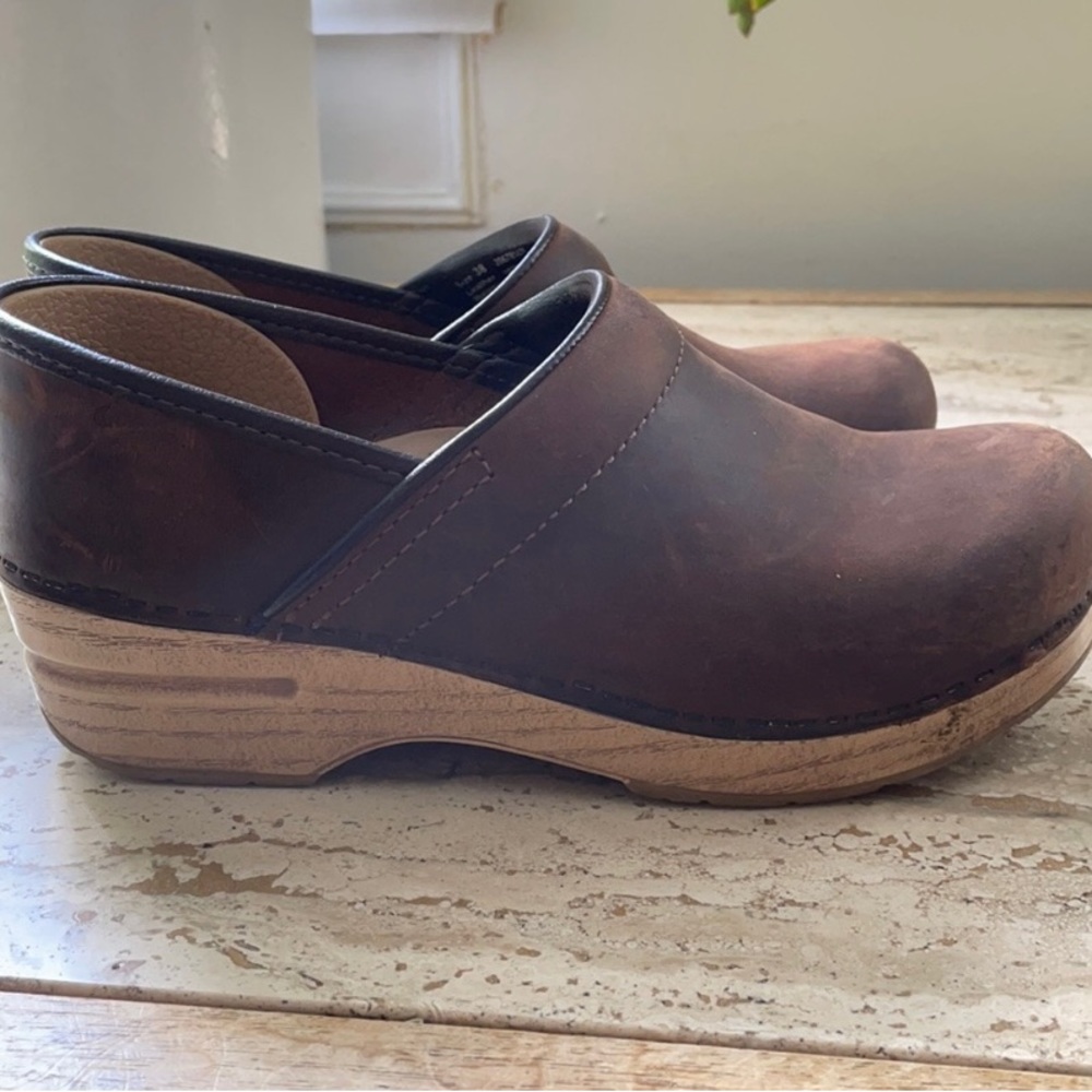 Brown Dansko clog with wooden heel